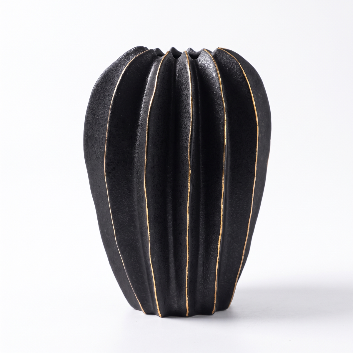 Black ribbed carambola ceramic vase on a white background