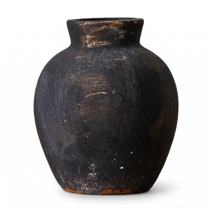 Black wabi-sabi ceramic jar on a white background