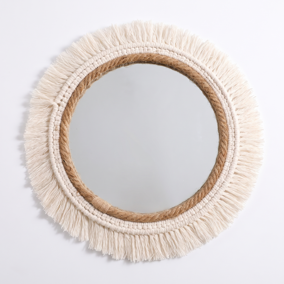 Boho macrame fringe round wall mirror on a white background