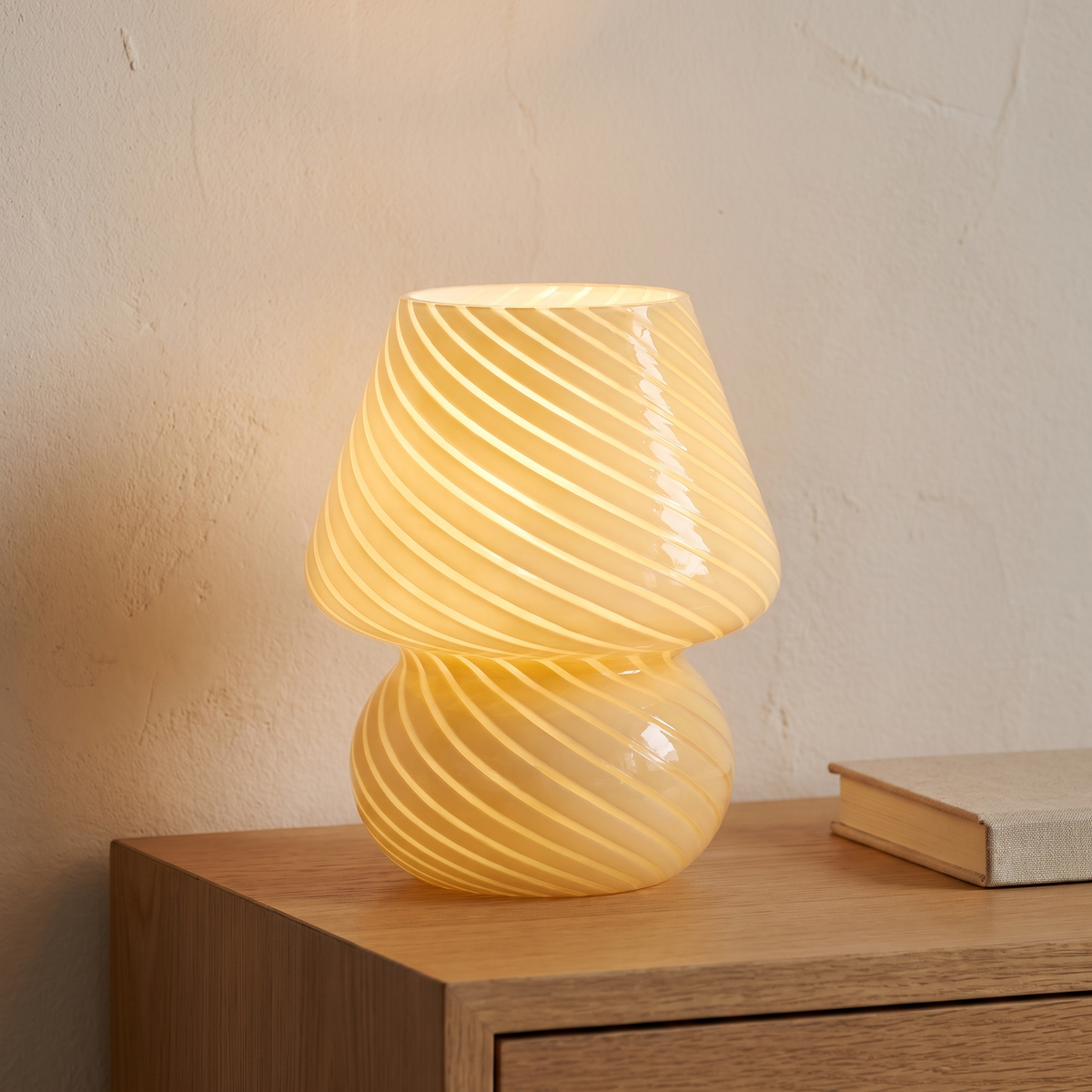 Butter yellow swirl glass mushroom lamp displayed in a warm modern interior