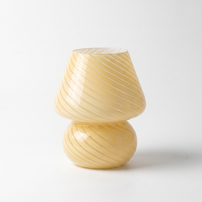 Butter yellow swirl glass mushroom lamp on a white background