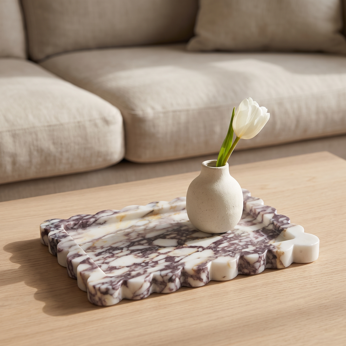 Calacatta Viola scalloped marble tray displayed in a warm modern interior