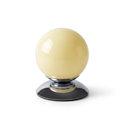 Cornsilk glass globe table lamp on a white background
