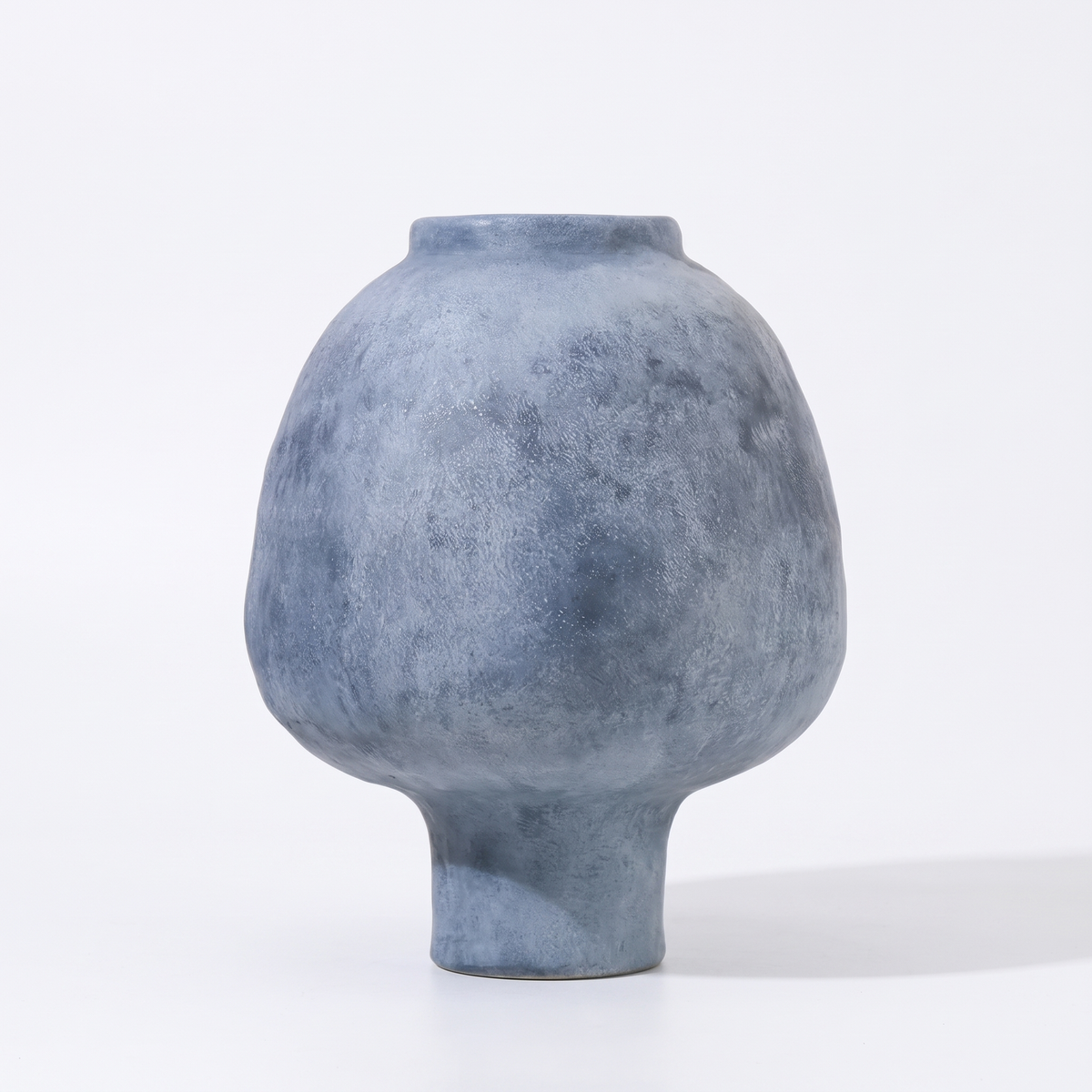 Handmade stoneware pedestal vase – Blue, on a white background