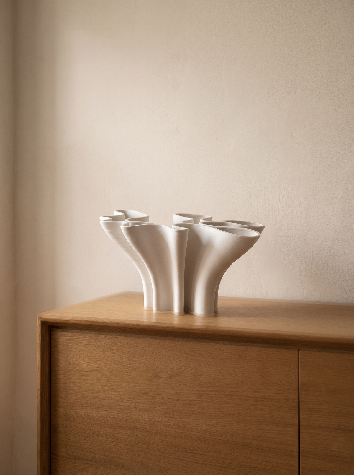 Ceramic vase styled alone on a sideboard