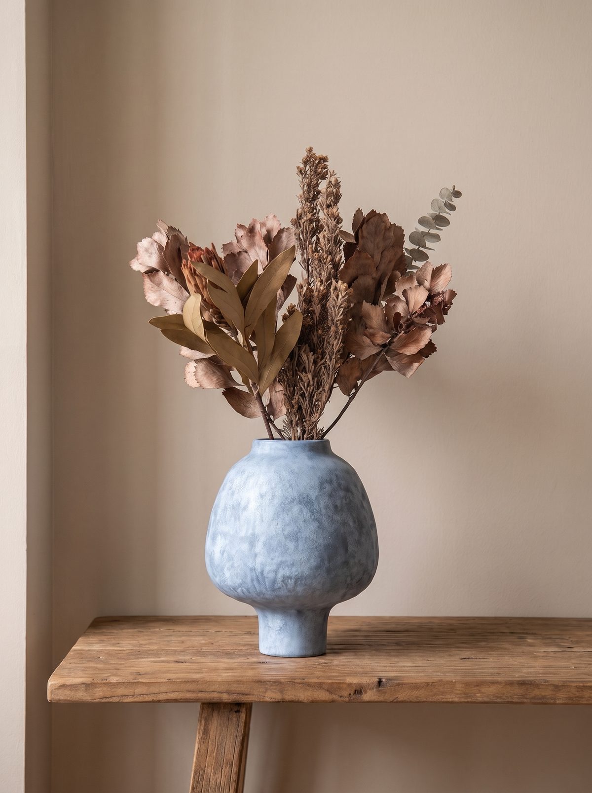 Ceramic vase alone on a shelf