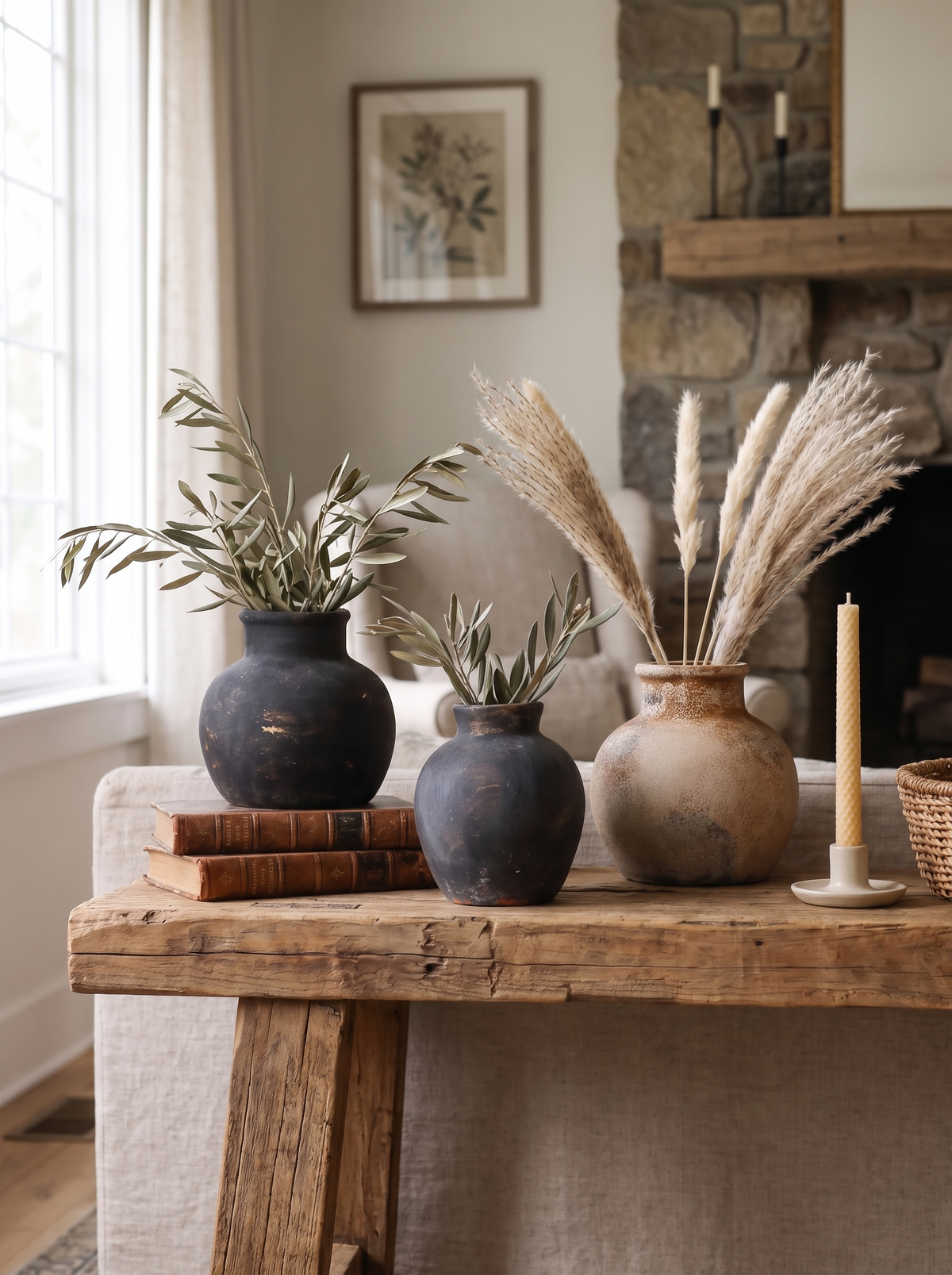 Farmhouse vase with dried stems on a mantel