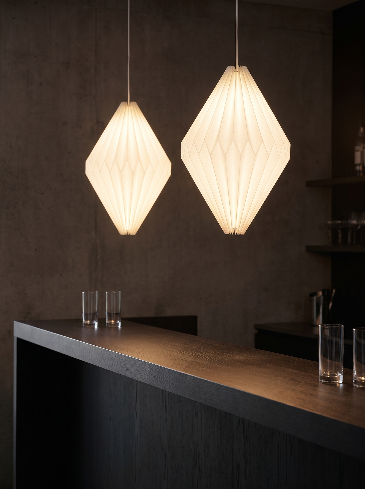 Paper lantern pendant glowing above a bar counter