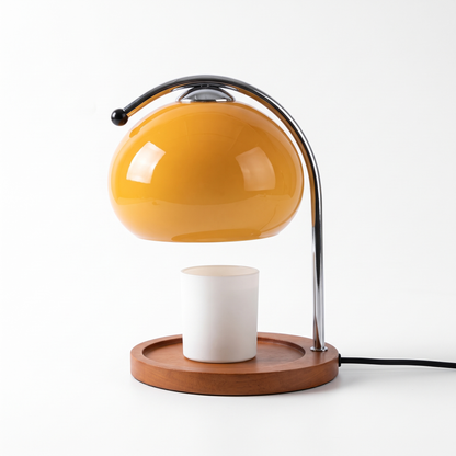 Orange glass candle warmer lamp on a white background