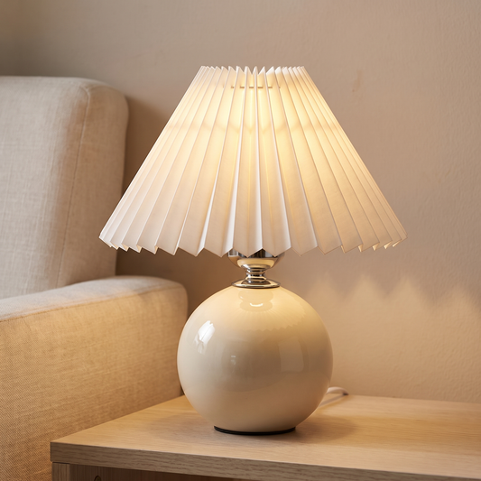 Rice white ceramic lamp with pleated shade displayed in a warm modern interior