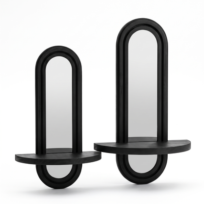 Set of two black arched wall mirrors with shelves on a white background